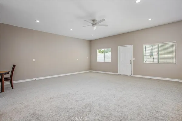 a room with furniture and flat screen tv