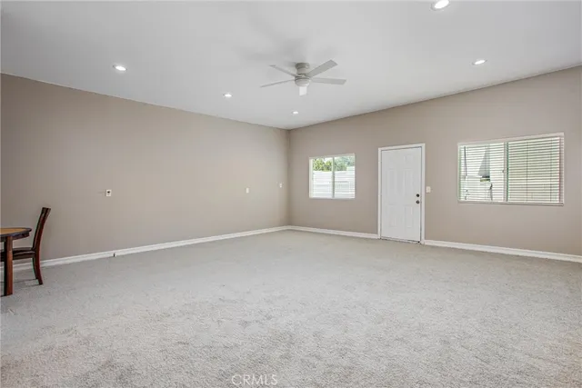 a room with furniture and flat screen tv