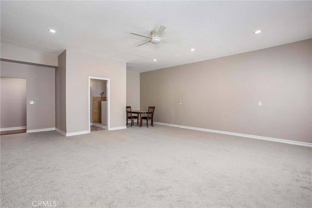 31607 Florida Street Redlands, CA 92373 - Photo 43 of 65 an empty room with a ceiling fan and a window
