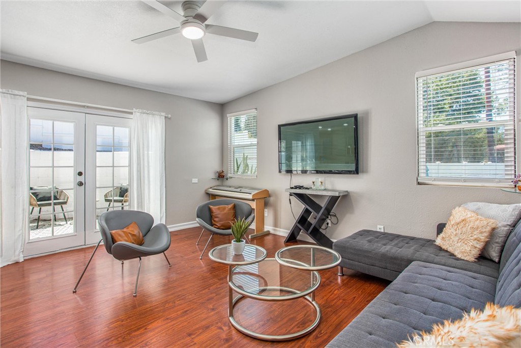 31607 Florida Street Redlands, CA 92373 - Photo 44 of 65 a living room with furniture and a flat screen tv with wooden floor