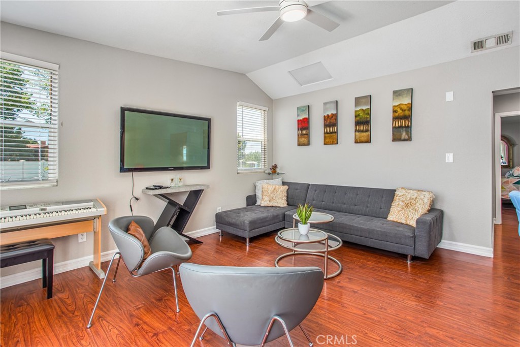 31607 Florida Street Redlands, CA 92373 - Photo 45 of 65 a living room with furniture a flat screen tv and a window