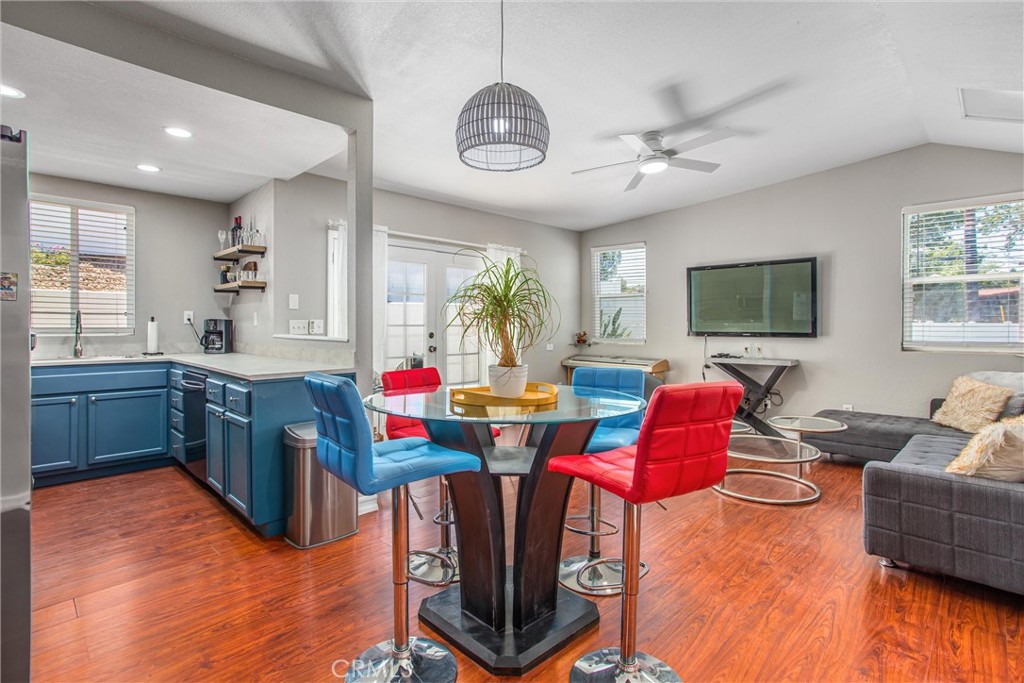 31607 Florida Street Redlands, CA 92373 - Photo 48 of 65 a living room with furniture a flat screen tv and kitchen view