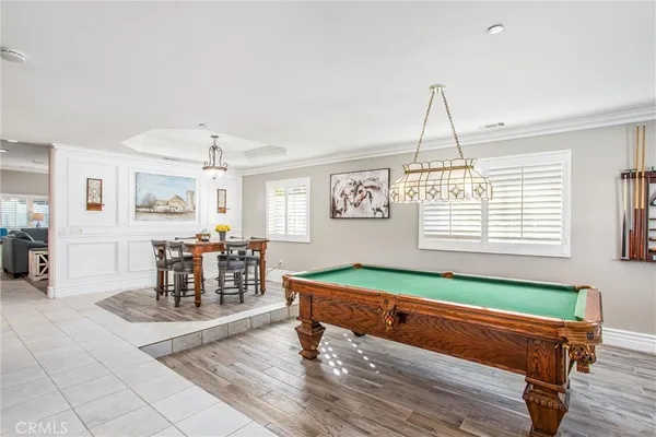 a living room with furniture a fireplace and window