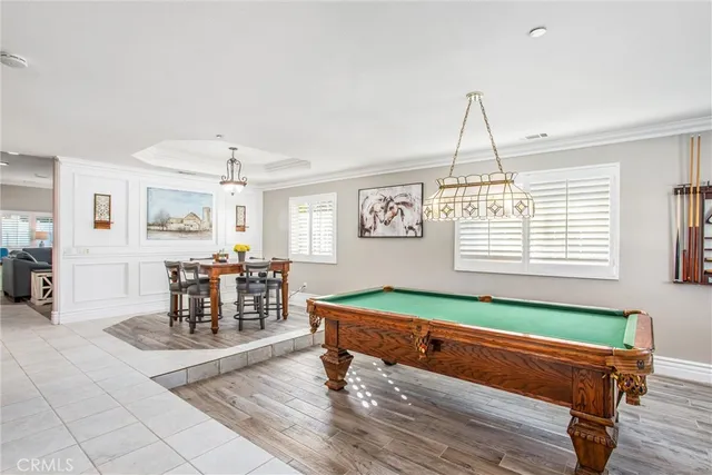 a living room with furniture a fireplace and window