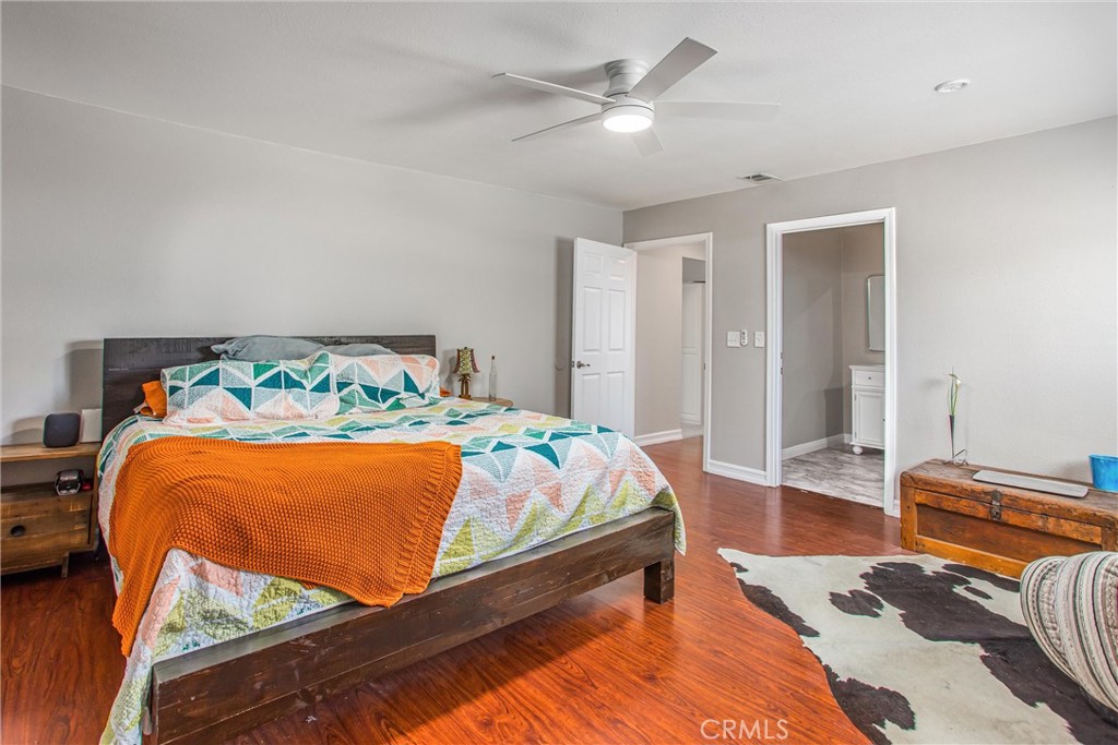 31607 Florida Street Redlands, CA 92373 - Photo 57 of 65 a bedroom with a bed and a chandelier