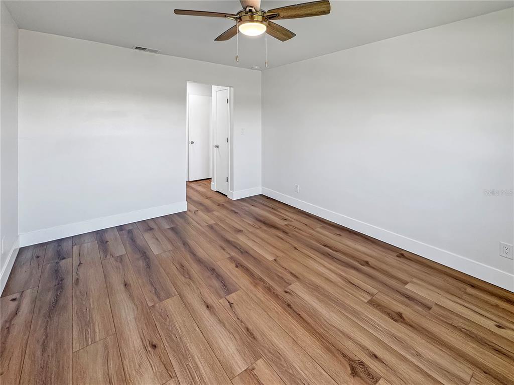 Undisclosed Address Seminole, FL 33777 - Photo 14 of 21 a view of an empty room with wooden floor