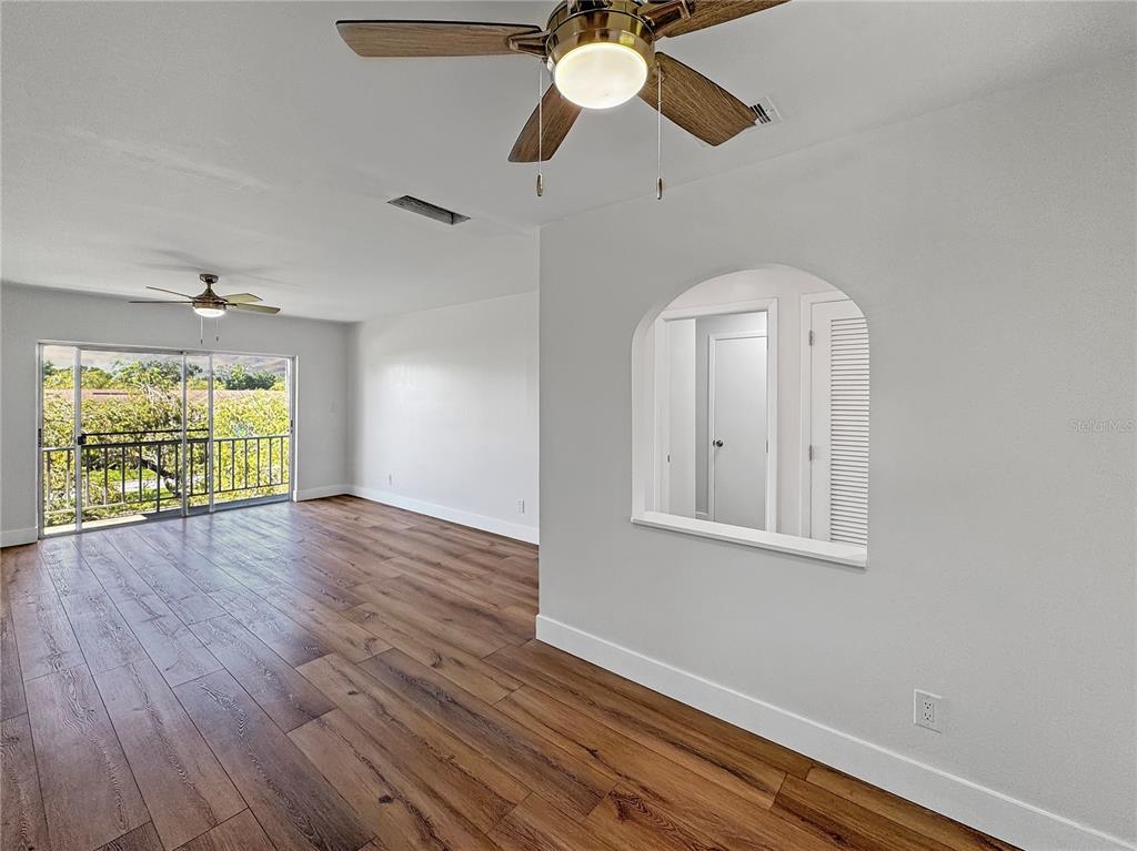 Undisclosed Address Seminole, FL 33777 - Photo 19 of 21 a view of empty room with wooden floor and fan