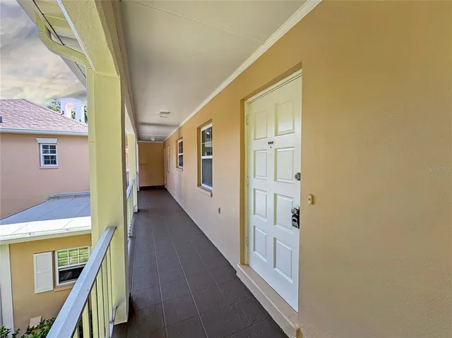 a view of a hallway with white walls