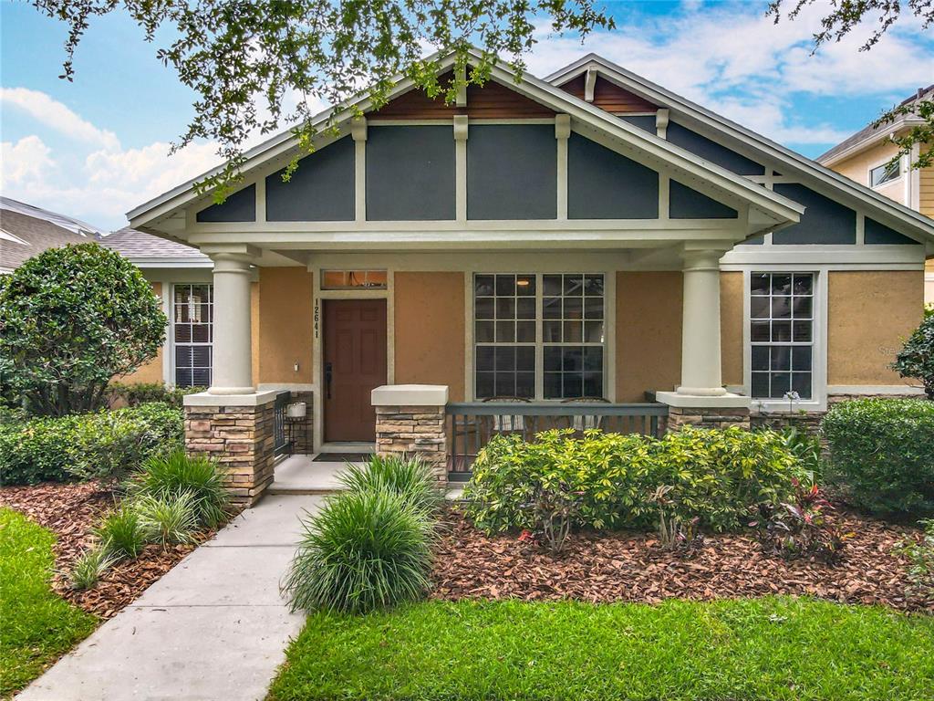 a front view of a house with garden