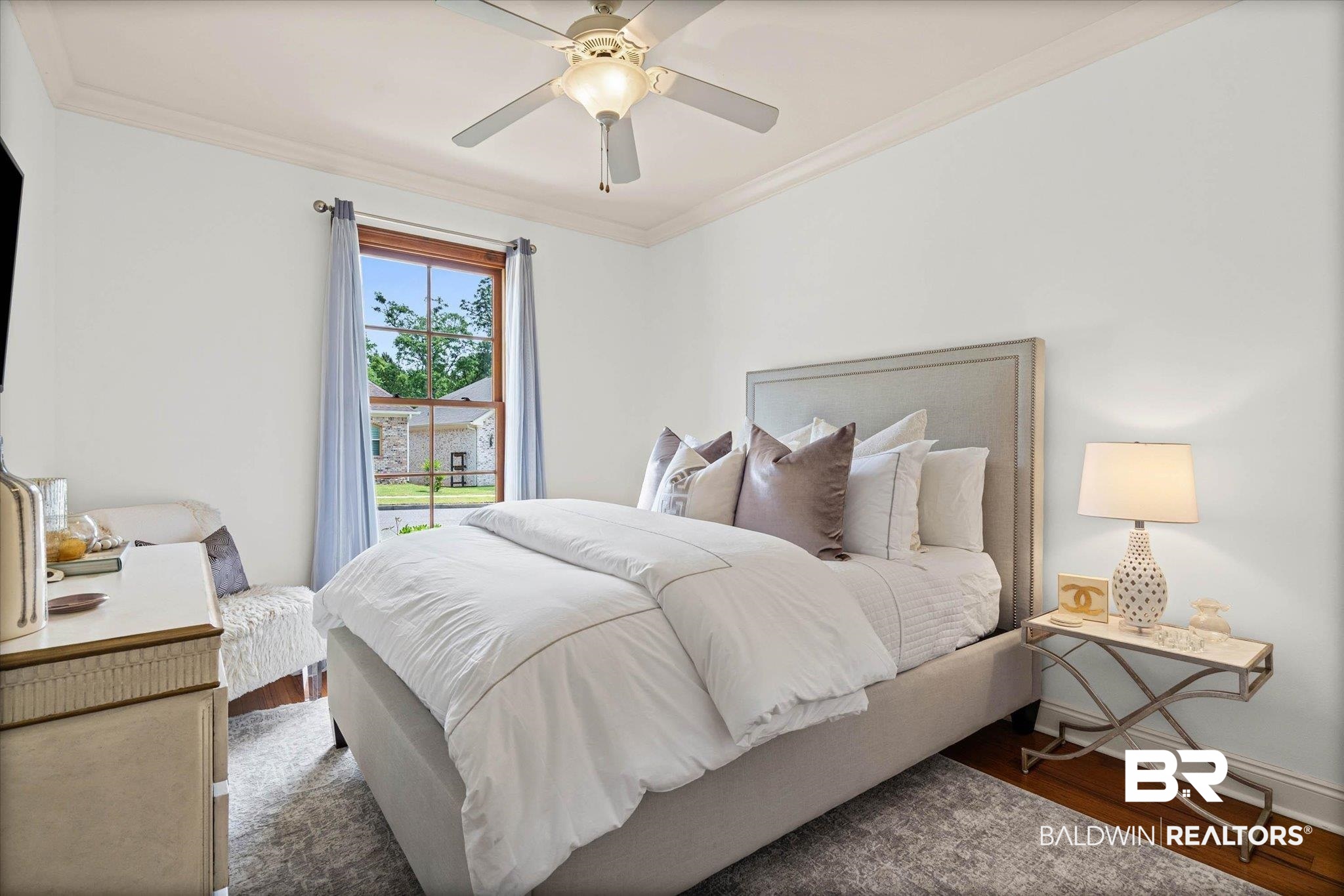 3459 Rue Royal Mobile, AL 36693 - Photo 22 of 31 Bright room featuring a wood-framed window, crown molding, and hardwood flooring
