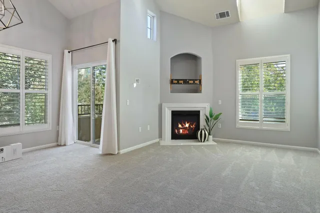a view of empty room with floor to ceiling window