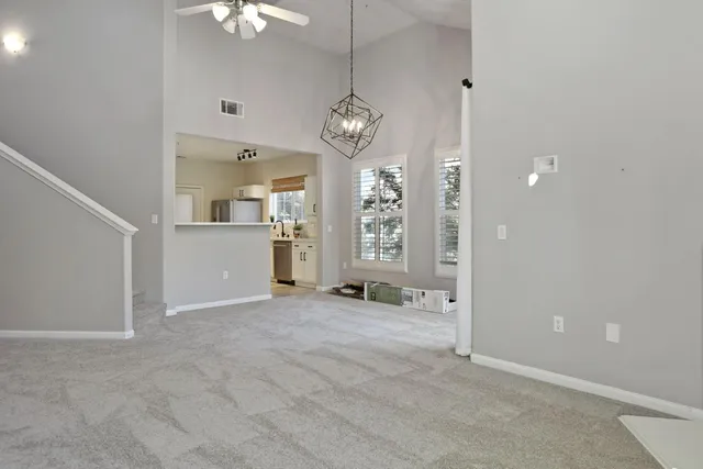 a kitchen with a stove and white cabinets