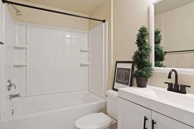 a bathroom with a sink double vanity and a mirror