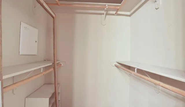 a view of an empty room with a window