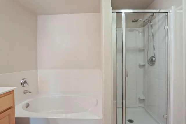 a kitchen with stainless steel appliances a refrigerator and cabinets