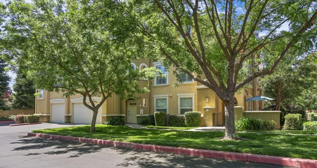 front view of a house with a garden