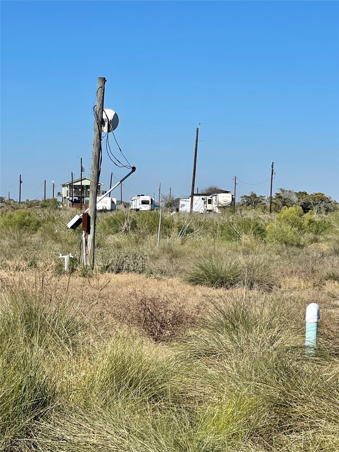 270 Titanic Street Sargent, TX 77414 - Photo 5 of 6 a view of a backyard of the house