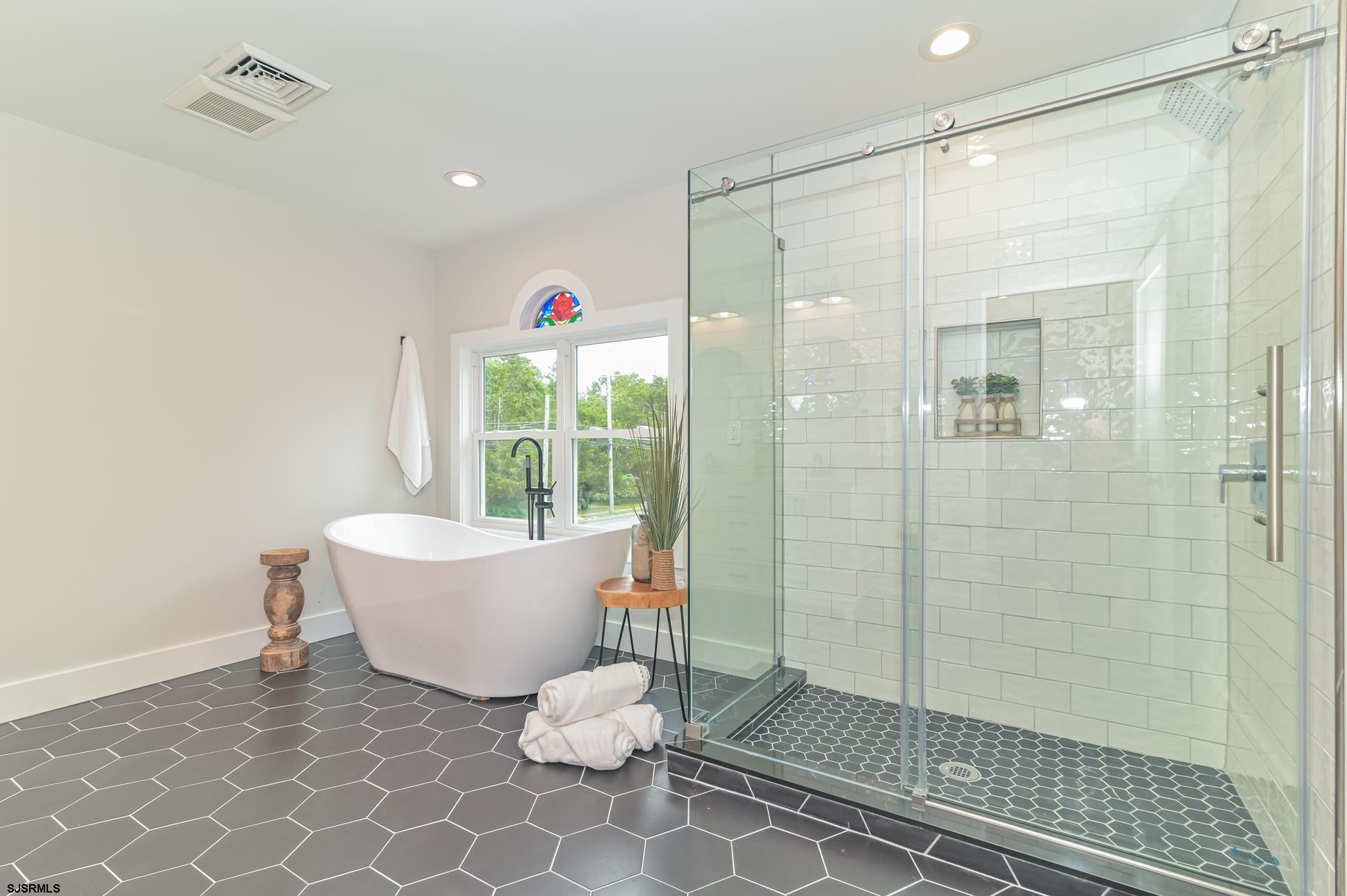 1828 Shore Road Linwood, NJ 08221 - Photo 13 of 20 a bathroom with a bathtub and shower