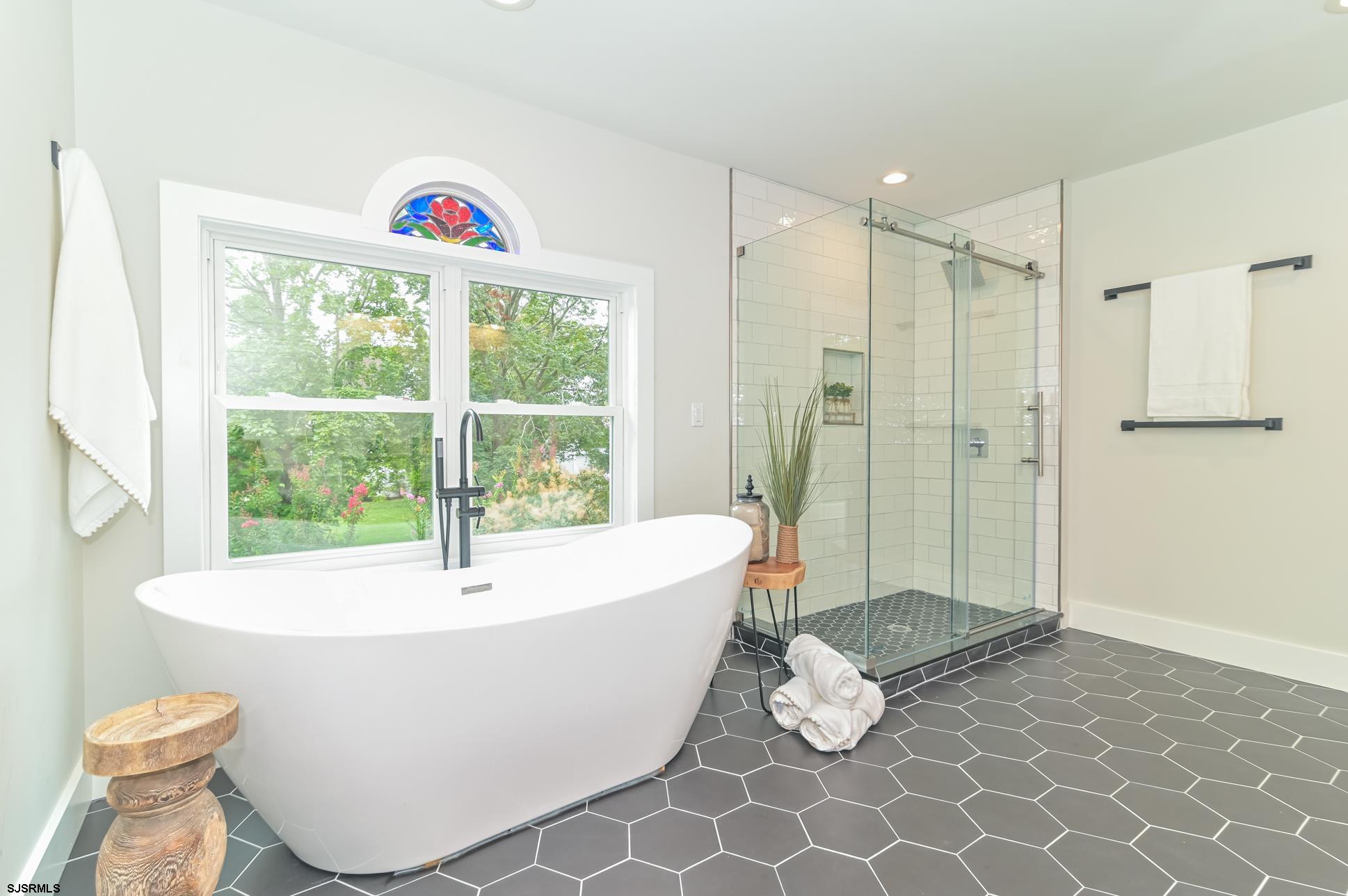 1828 Shore Road Linwood, NJ 08221 - Photo 15 of 20 a bathroom with a bathtub and a shower