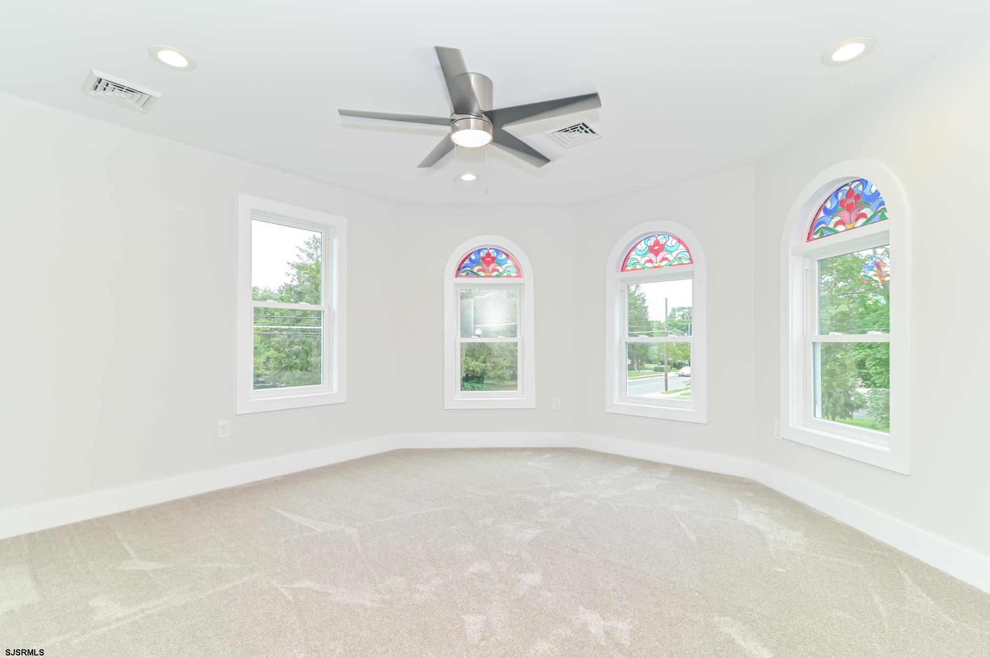 1828 Shore Road Linwood, NJ 08221 - Photo 18 of 20 an empty room with windows and ceiling fan