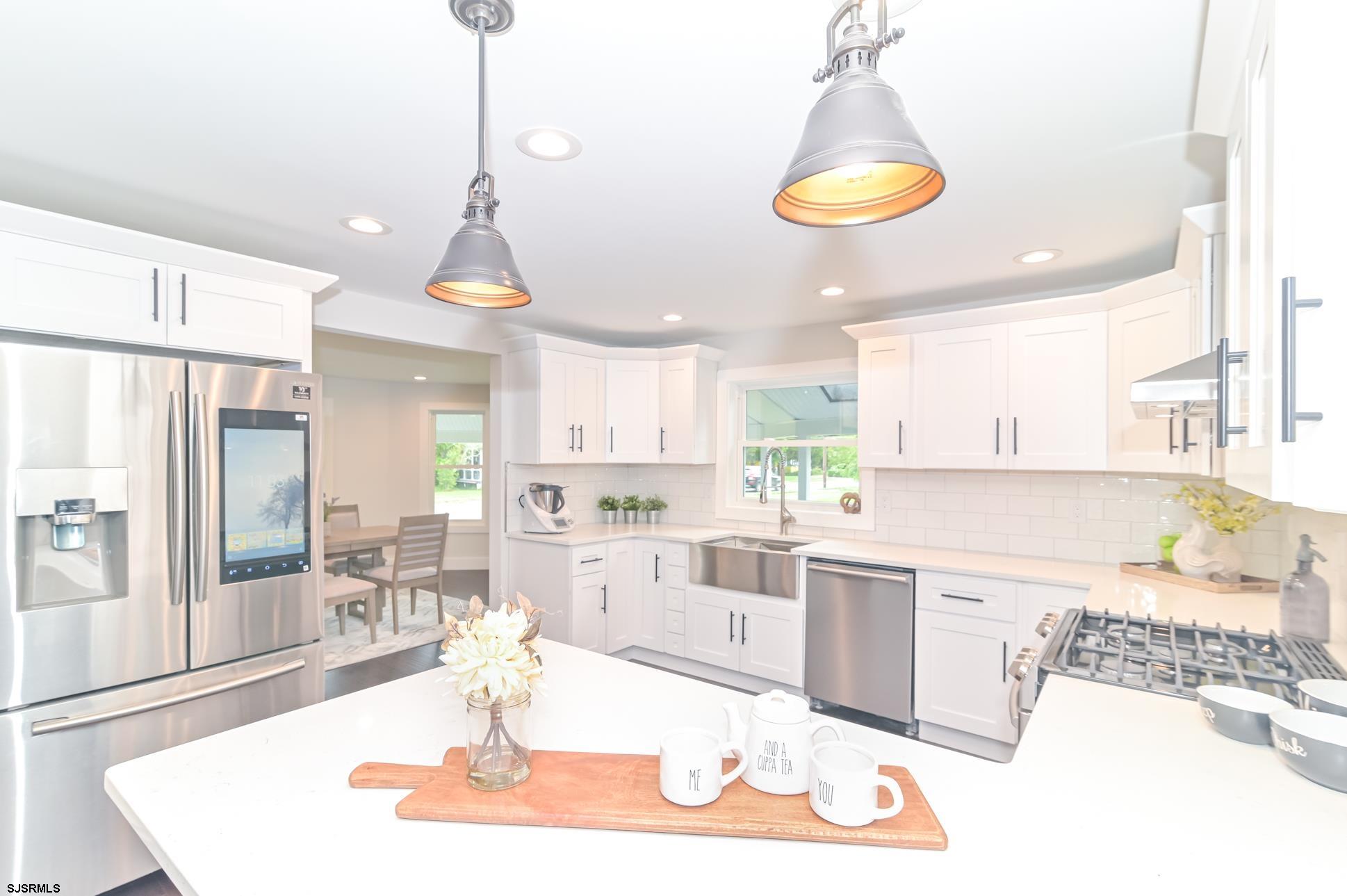 1828 Shore Road Linwood, NJ 08221 - Photo 4 of 20 a large kitchen with a table and chairs