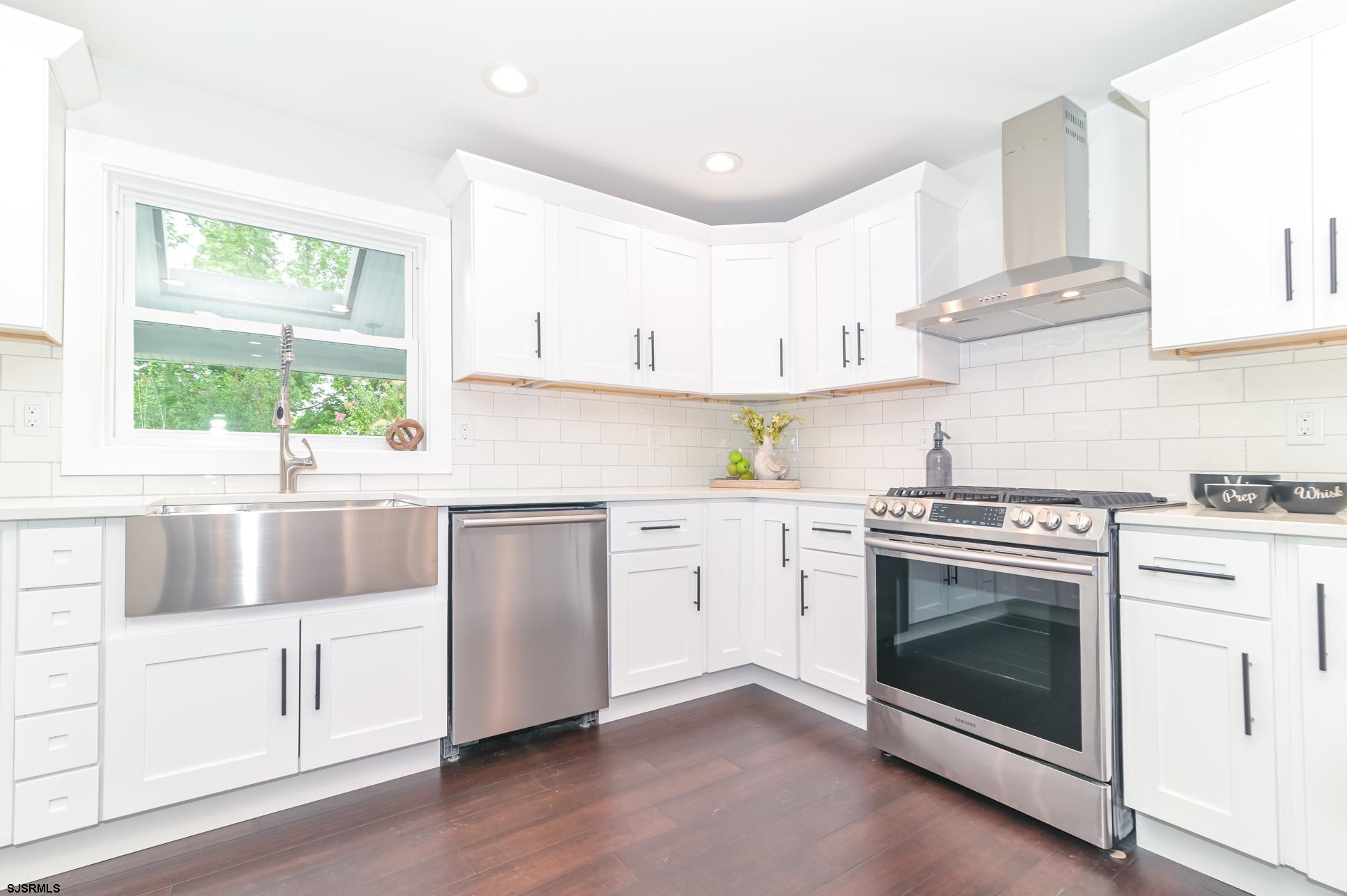 1828 Shore Road Linwood, NJ 08221 - Photo 5 of 20 a kitchen with cabinets appliances a sink and a window