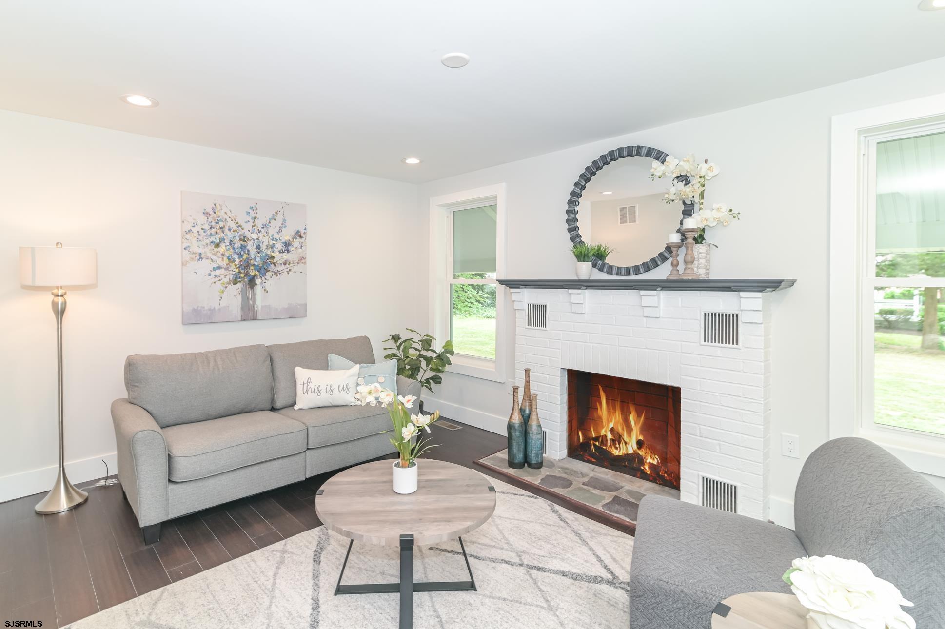 1828 Shore Road Linwood, NJ 08221 - Photo 6 of 20 a living room with furniture a fireplace with wooden floor