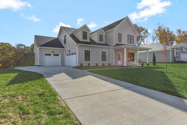 a view of a hallway with wooden floor and a chandelier