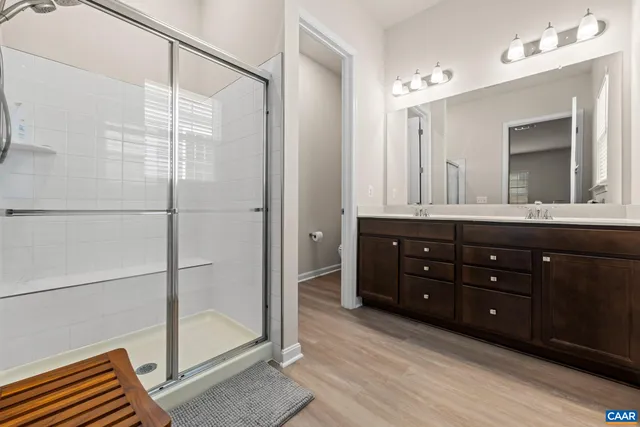 a bathroom with a shower and a sink