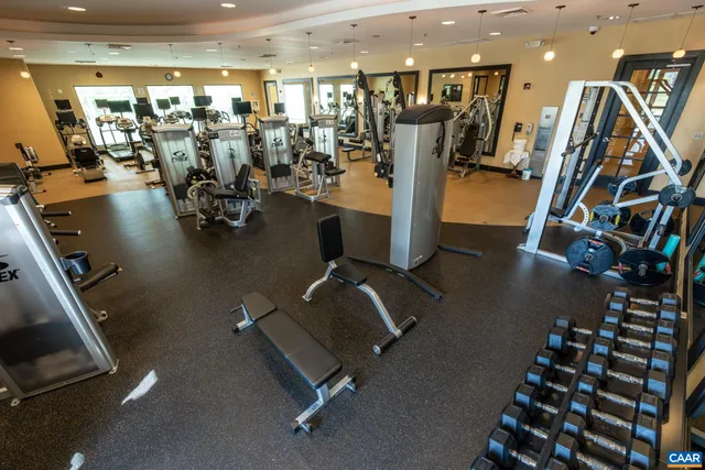 a room with furniture pool table table tennis and arcade game machine