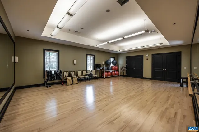 a living room with fireplace furniture and a flat screen tv
