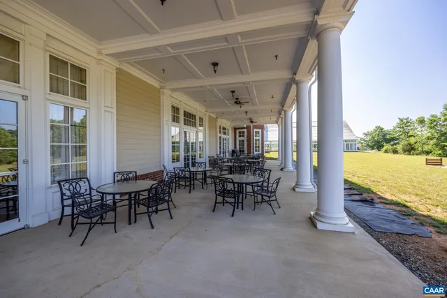 a view of a swimming pool with lounge chair