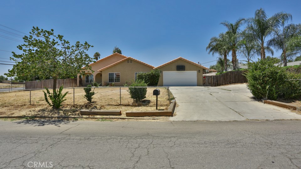6428 Chadbourne Avenue Riverside, CA 92505 - Photo 1 of 1 a front view of a house with a yard and garage