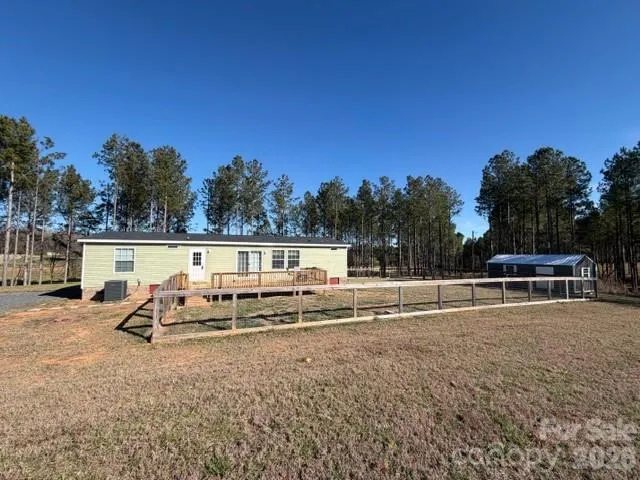 a view of a swimming pool with a lounge chair
