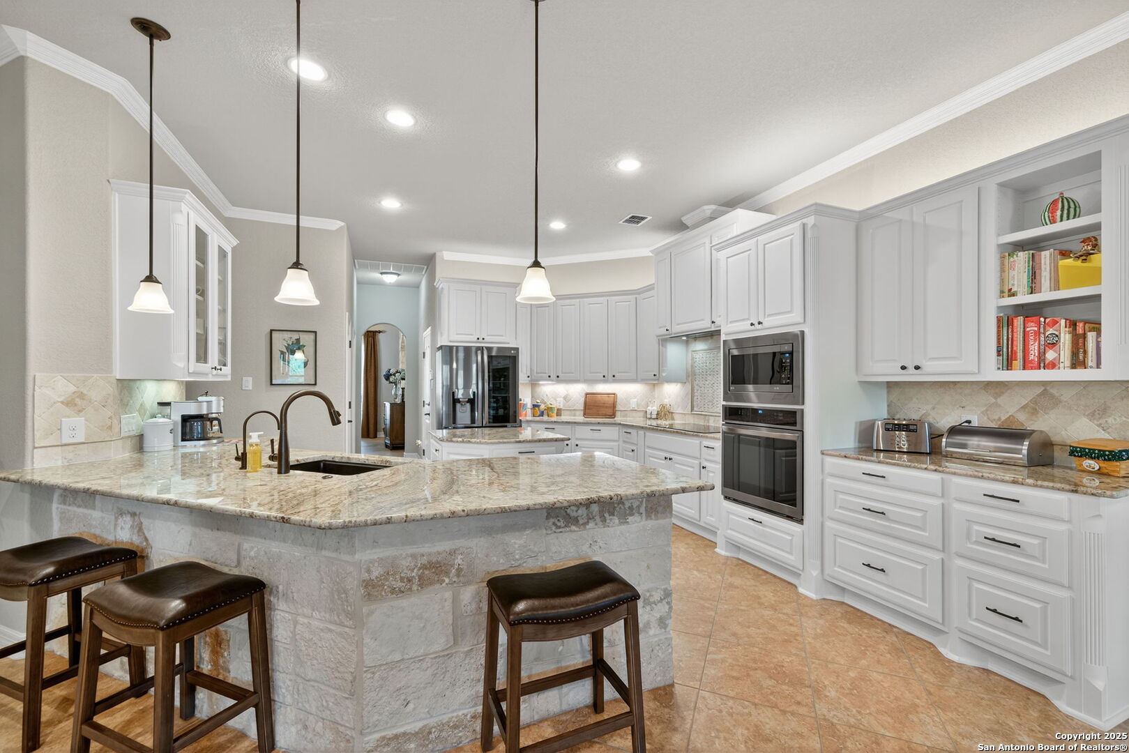 30210 Setterfeld Circle Fair Oaks Ranch, TX 78015 - Photo 1 of 30 a kitchen with kitchen island granite countertop a stove a sink a oven a dining table and chairs with wooden floor