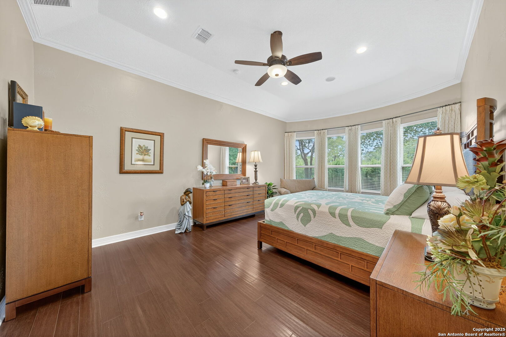 30210 Setterfeld Circle Fair Oaks Ranch, TX 78015 - Photo 11 of 30 a spacious bedroom with a bed couch and window