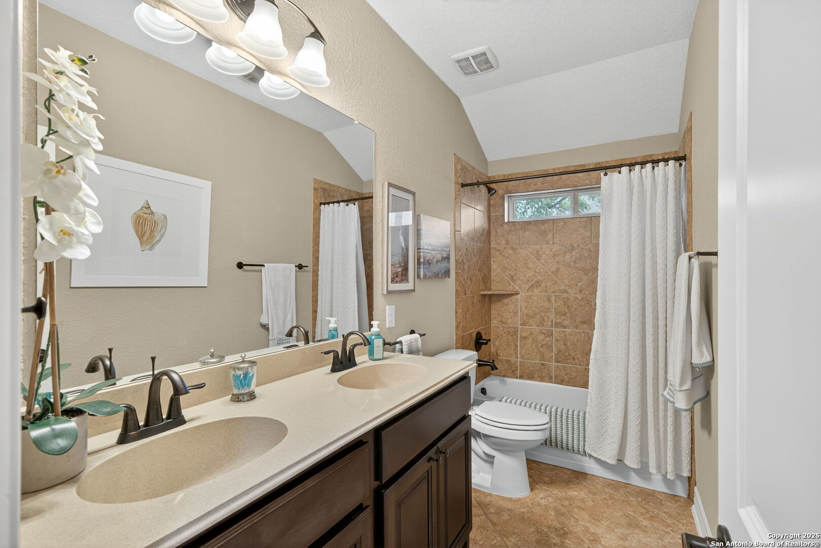 30210 Setterfeld Circle Fair Oaks Ranch, TX 78015 - Photo 22 of 30 a bathroom with a granite countertop sink a toilet and a mirror