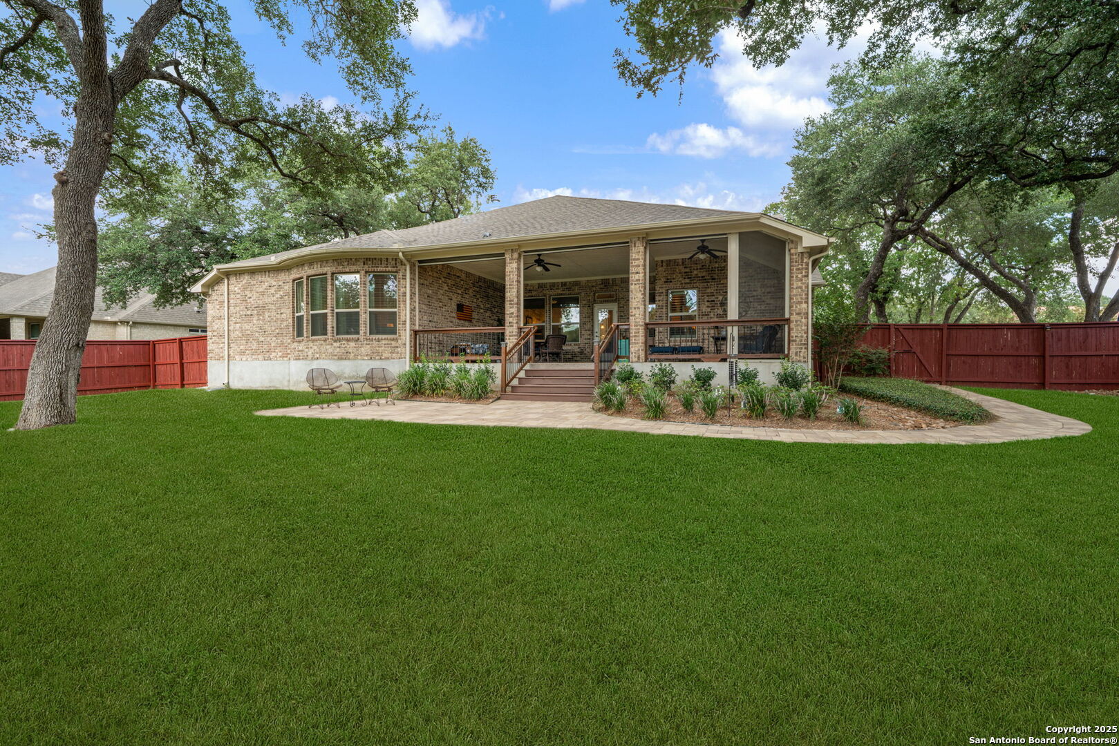 30210 Setterfeld Circle Fair Oaks Ranch, TX 78015 - Photo 27 of 30 a front view of house with a garden and patio