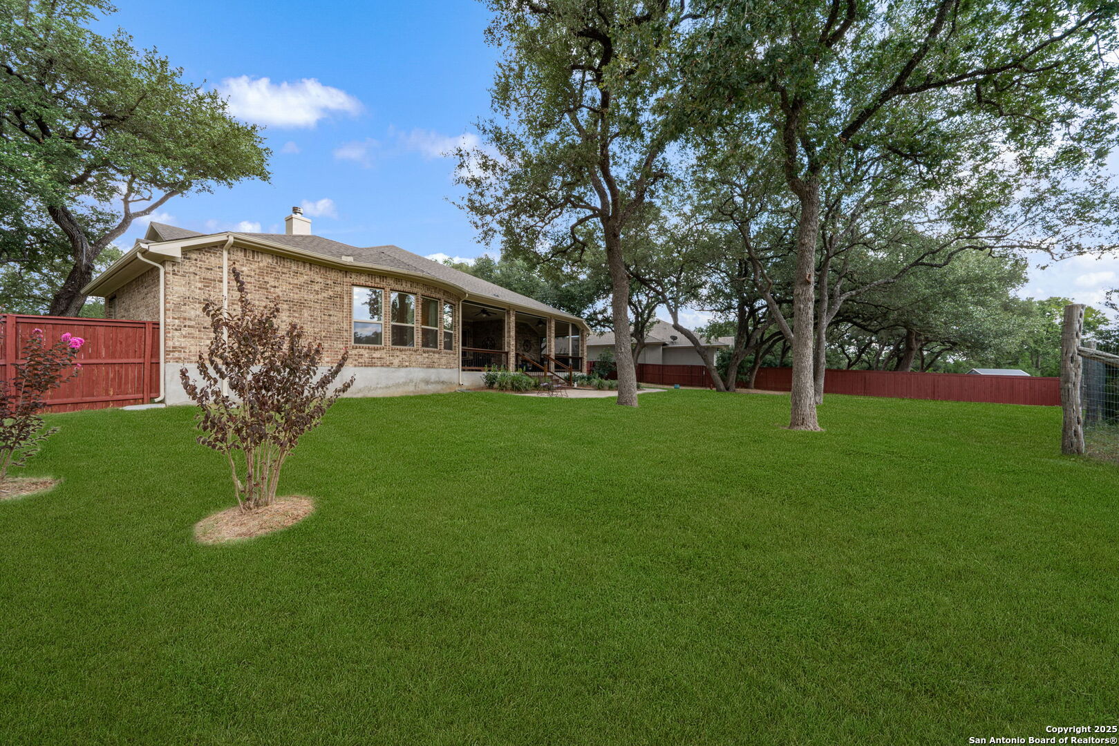 30210 Setterfeld Circle Fair Oaks Ranch, TX 78015 - Photo 28 of 30 a front view of a house with garden