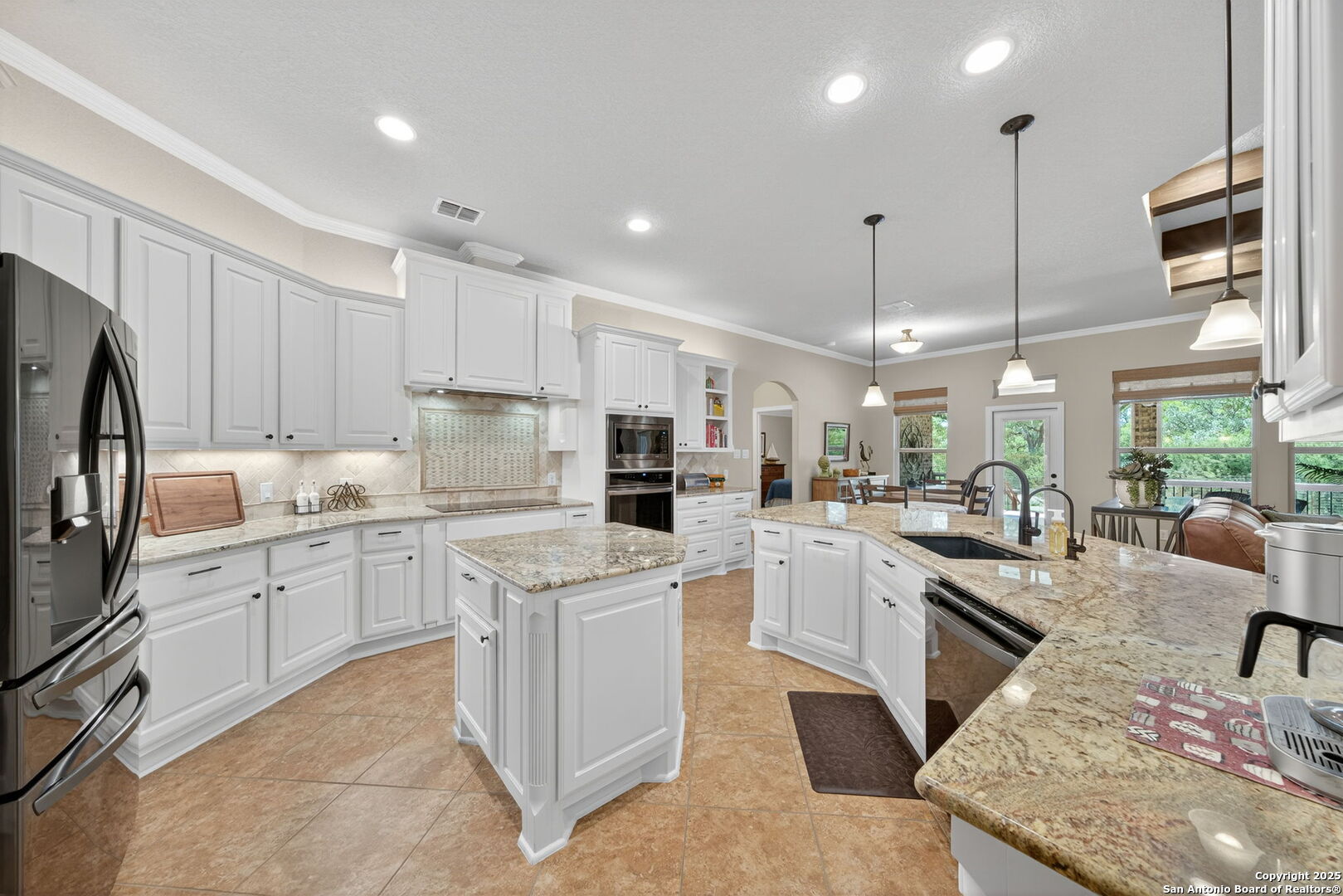 30210 Setterfeld Circle Fair Oaks Ranch, TX 78015 - Photo 4 of 30 a kitchen with white cabinets and white appliances
