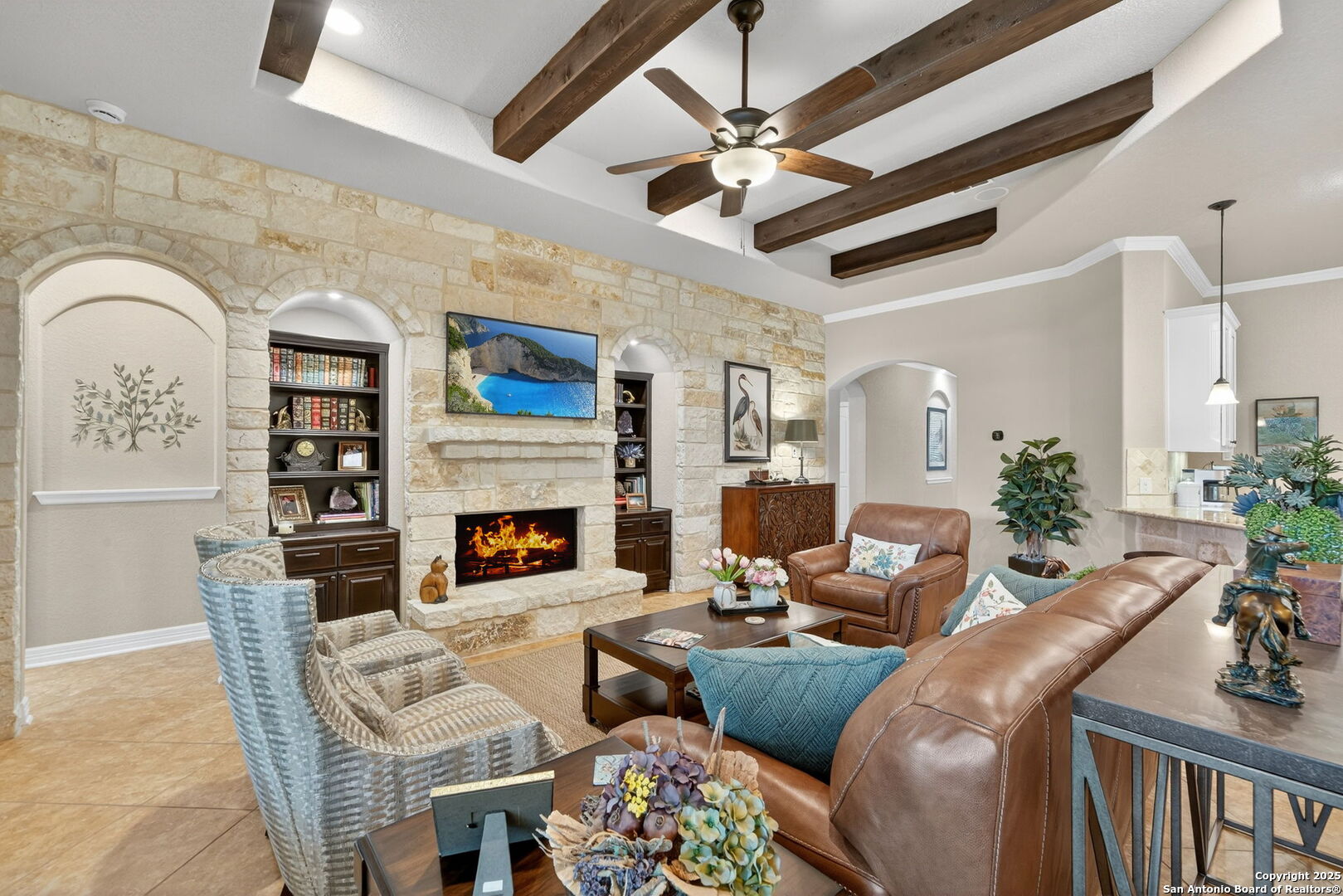 30210 Setterfeld Circle Fair Oaks Ranch, TX 78015 - Photo 8 of 30 a living room with furniture a fireplace and a chandelier