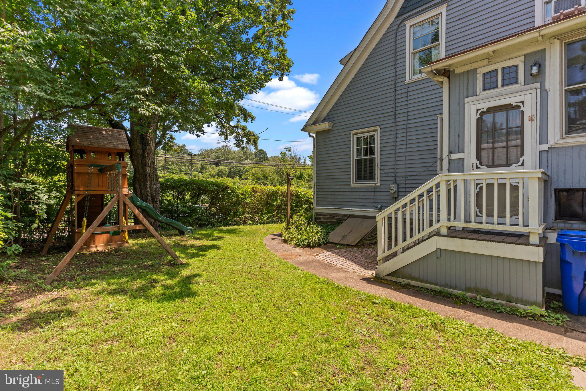 101 Cliff Terrace Wyncote, PA 19095 - Photo 17 of 21 a view of an house with backyard and a slide
