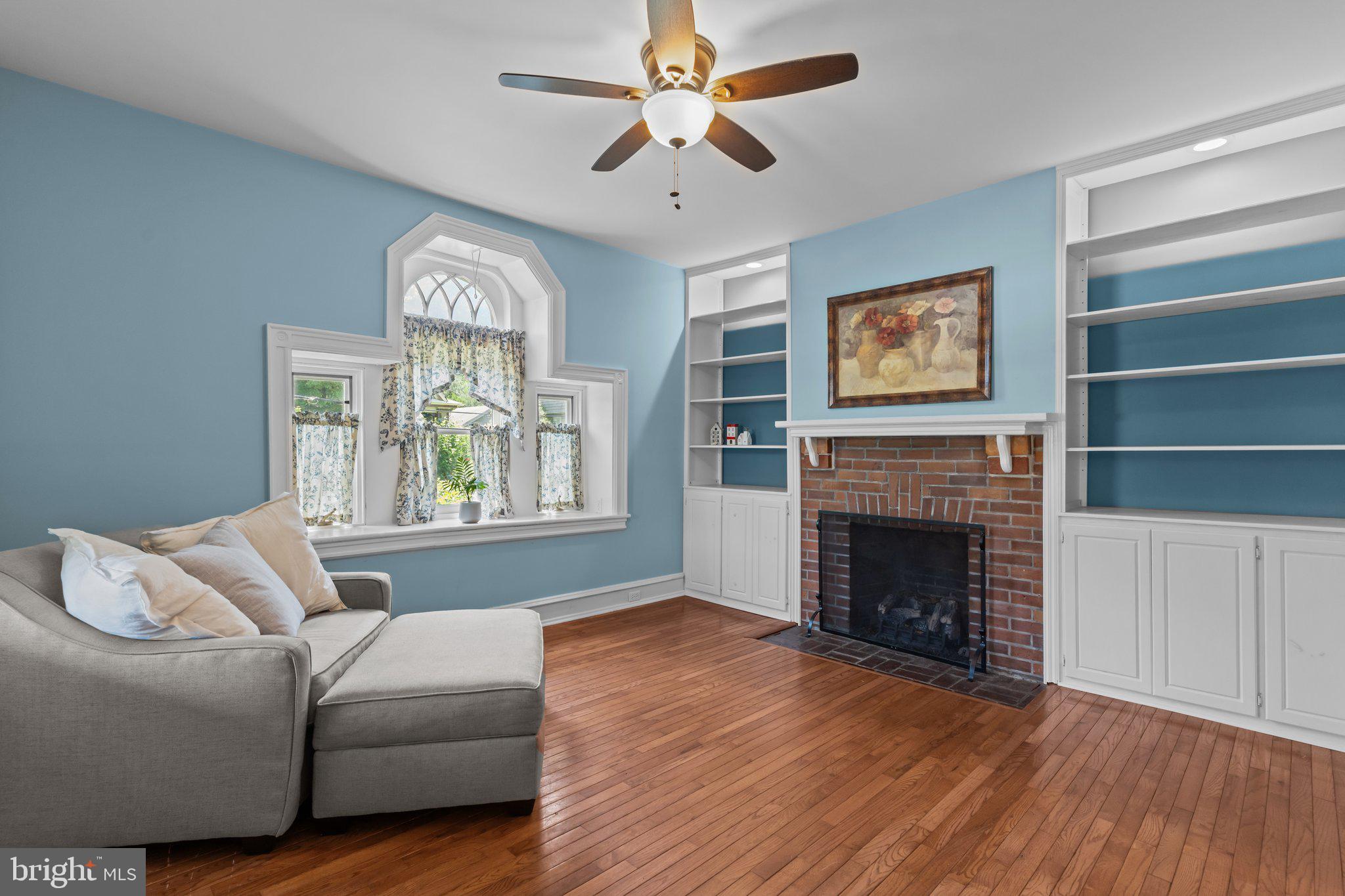101 Cliff Terrace Wyncote, PA 19095 - Photo 4 of 21 a living room with furniture and a fireplace
