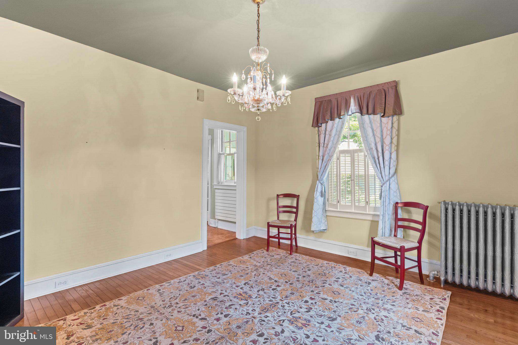 101 Cliff Terrace Wyncote, PA 19095 - Photo 5 of 21 a living room with furniture and a chandelier