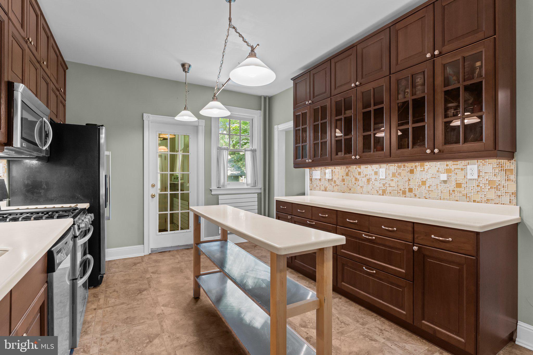 101 Cliff Terrace Wyncote, PA 19095 - Photo 7 of 21 a kitchen with a stove a sink and a refrigerator