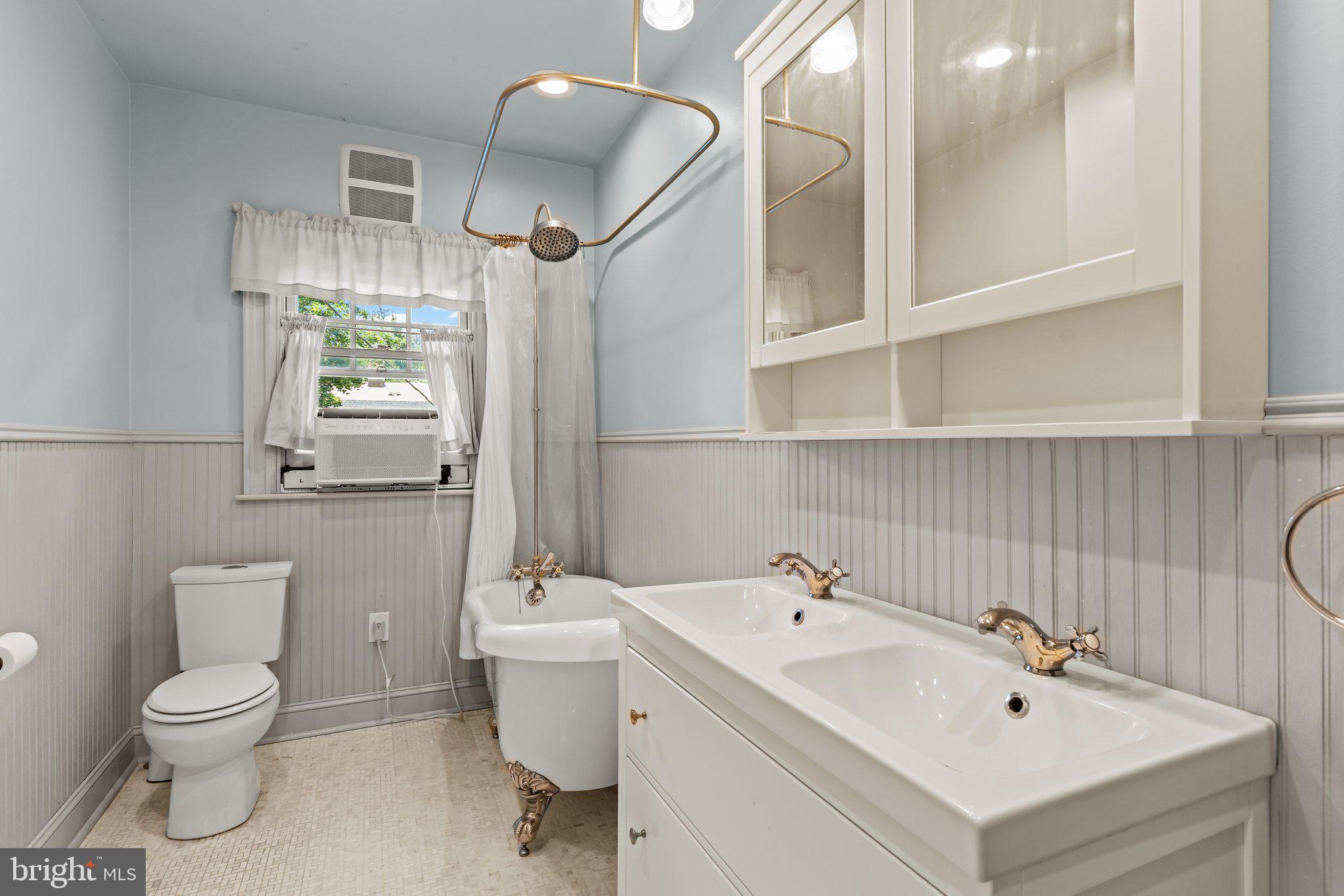 101 Cliff Terrace Wyncote, PA 19095 - Photo 10 of 21 a bathroom with a sink mirror and toilet
