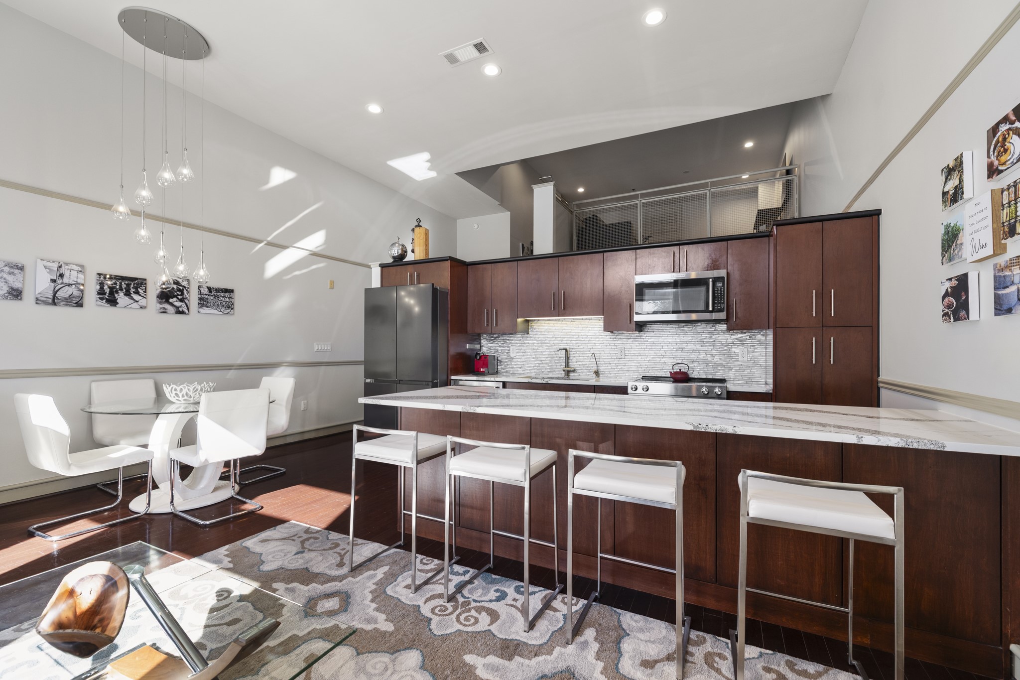 3311 Yupon Street, Unit 317 Houston, TX 77006 - Photo 12 of 28 a kitchen with stainless steel appliances granite countertop a sink and a refrigerator