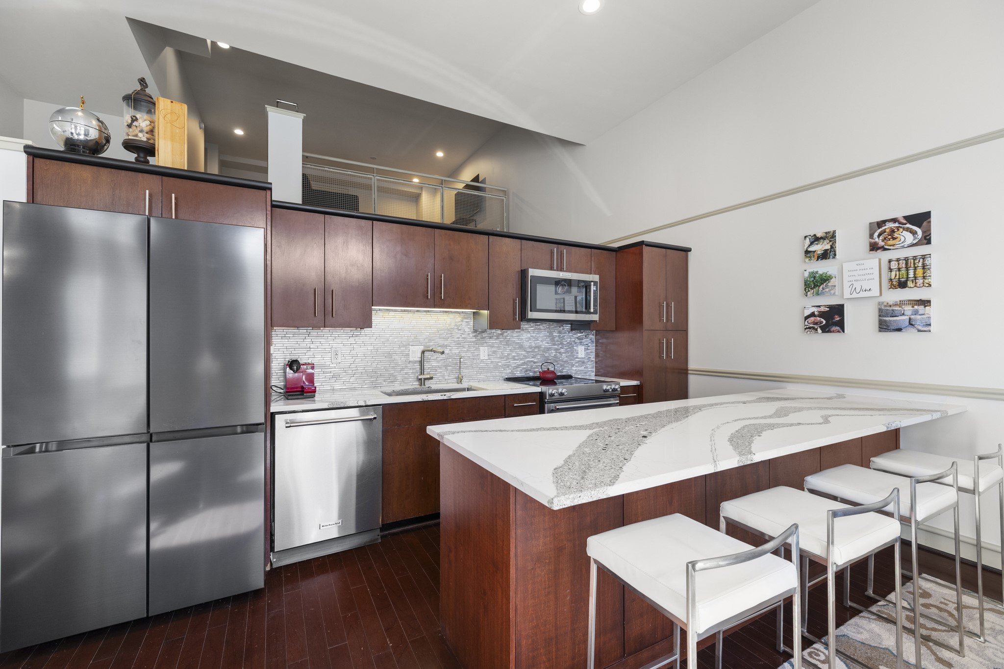 3311 Yupon Street, Unit 317 Houston, TX 77006 - Photo 15 of 28 a kitchen with stainless steel appliances granite countertop a refrigerator a sink and a stove