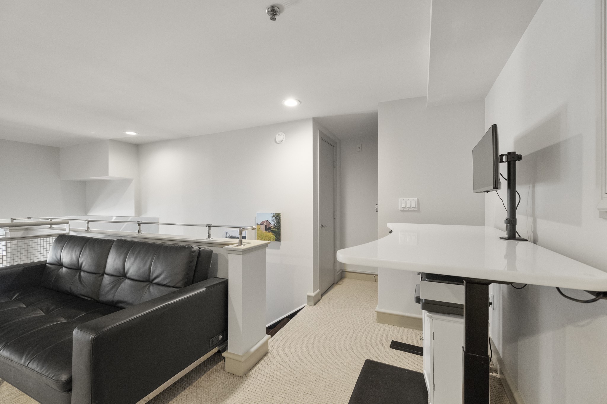 3311 Yupon Street, Unit 317 Houston, TX 77006 - Photo 25 of 29 a kitchen with stainless steel appliances kitchen island a table and chairs in it