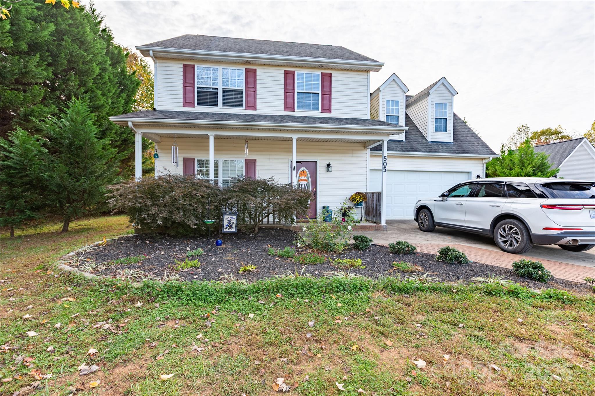 front view of a house with a yard